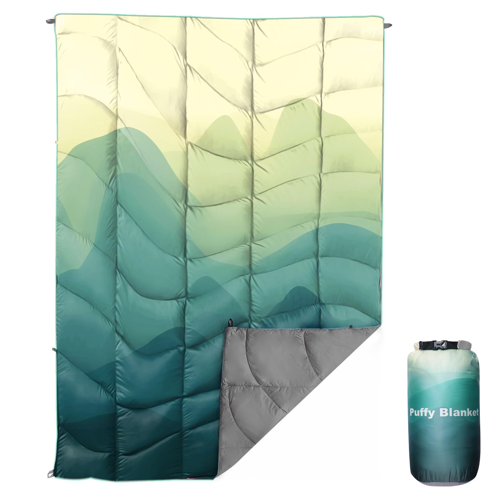 GLORSIGN waterproof puffy camping blanket laid out on grass, 55x79 inches