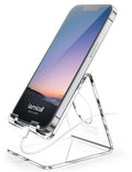 Lamicall clear acrylic phone stand on a desk holding a smartphone
