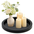 Ayiaren round black wooden decorative tray on a coffee table