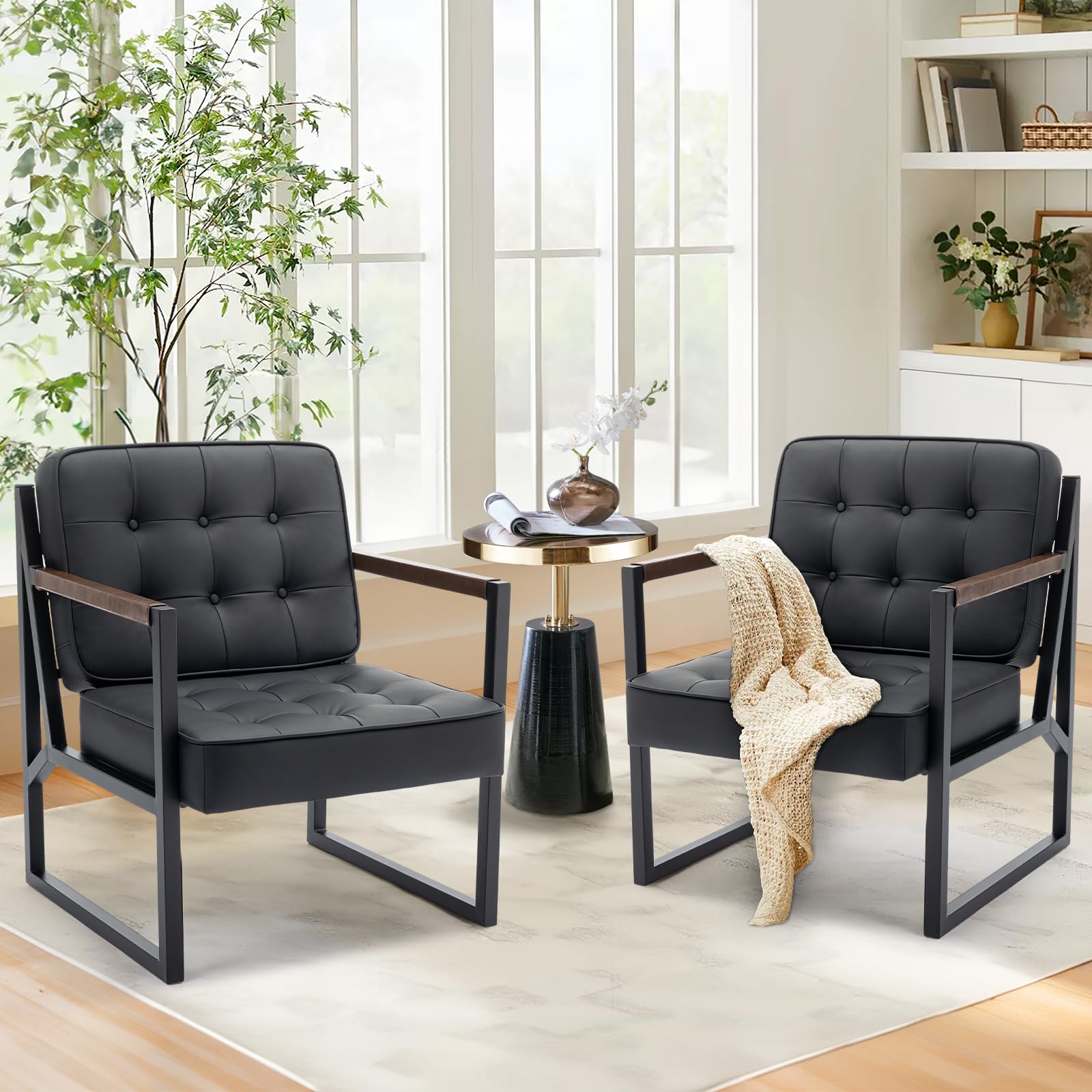 Pair of black faux leather mid-century accent chairs with metal legs