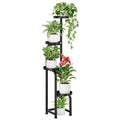 Bamworld tall metal plant stand holding flower pots in a corner, indoor/outdoor display