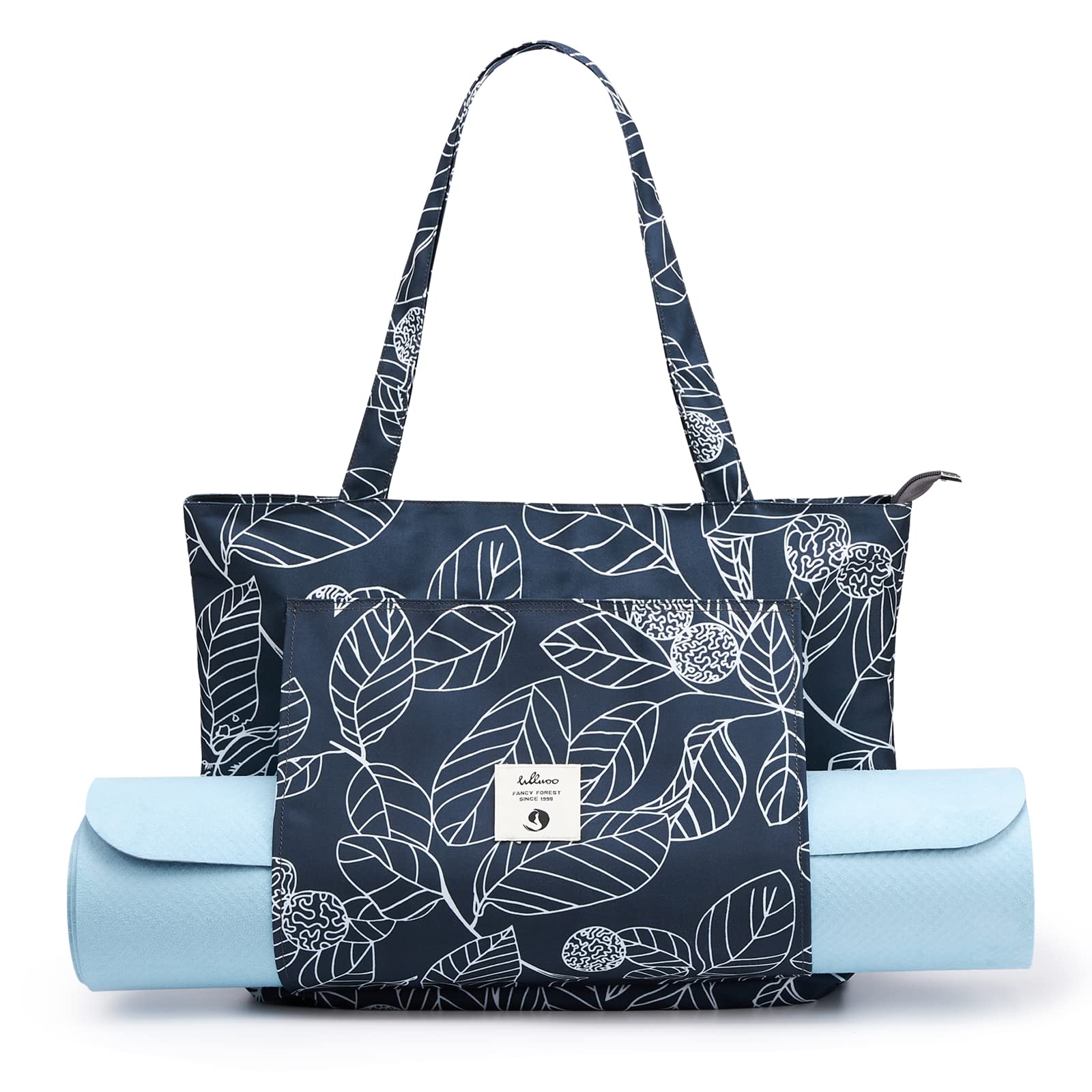 Leaf print canvas yoga bag showing shoulder strap, rolled yoga mat