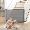 cideny retractable baby gate installed at top of stairs, in doorway