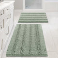Sage chenille bath rugs 32x20 and 24x17 on tiled bathroom floor