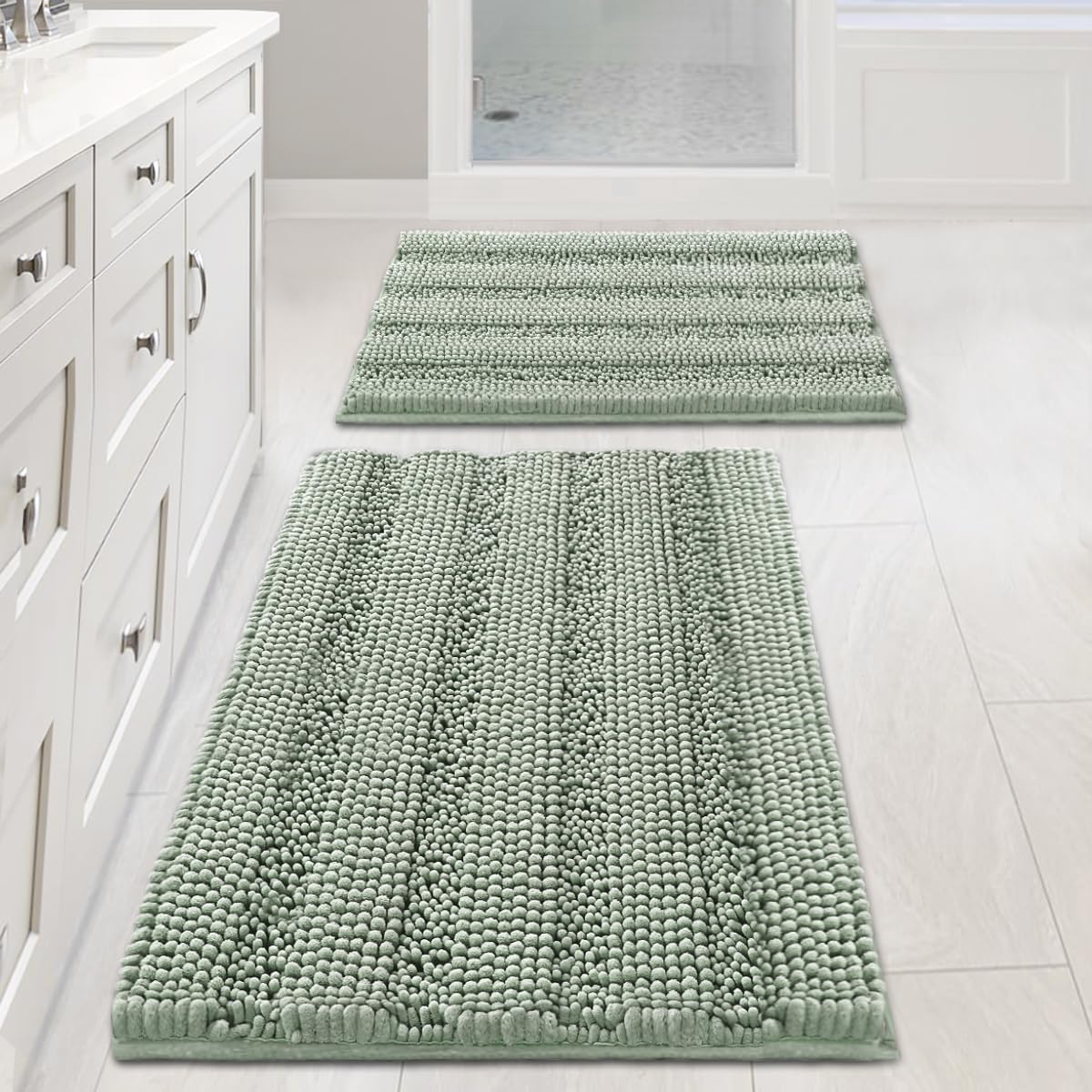 Sage chenille bath rugs 32x20 and 24x17 on tiled bathroom floor