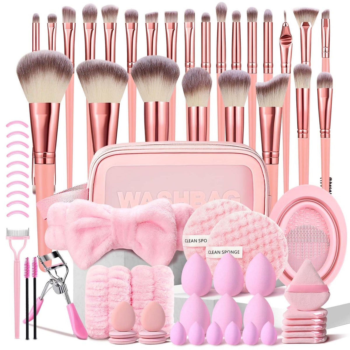 70 pink makeup brushes and tools laid out with a pink carrying case