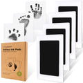 KeaBabies inkless jet black hand and footprint pads showing sample prints on white paper