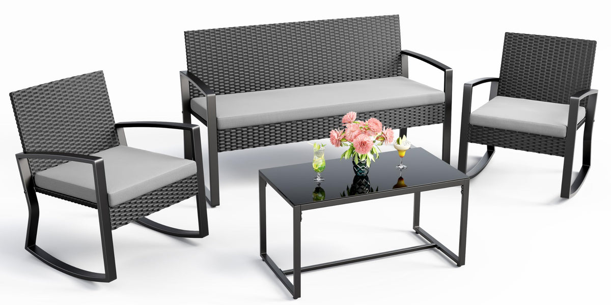Grey Ahomly 4-piece wicker patio bistro featuring glass coffee table and rocking chairs on a porch