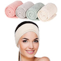 Four Whaline spa facial headbands in pea green, pink, beige and light gray displayed flat