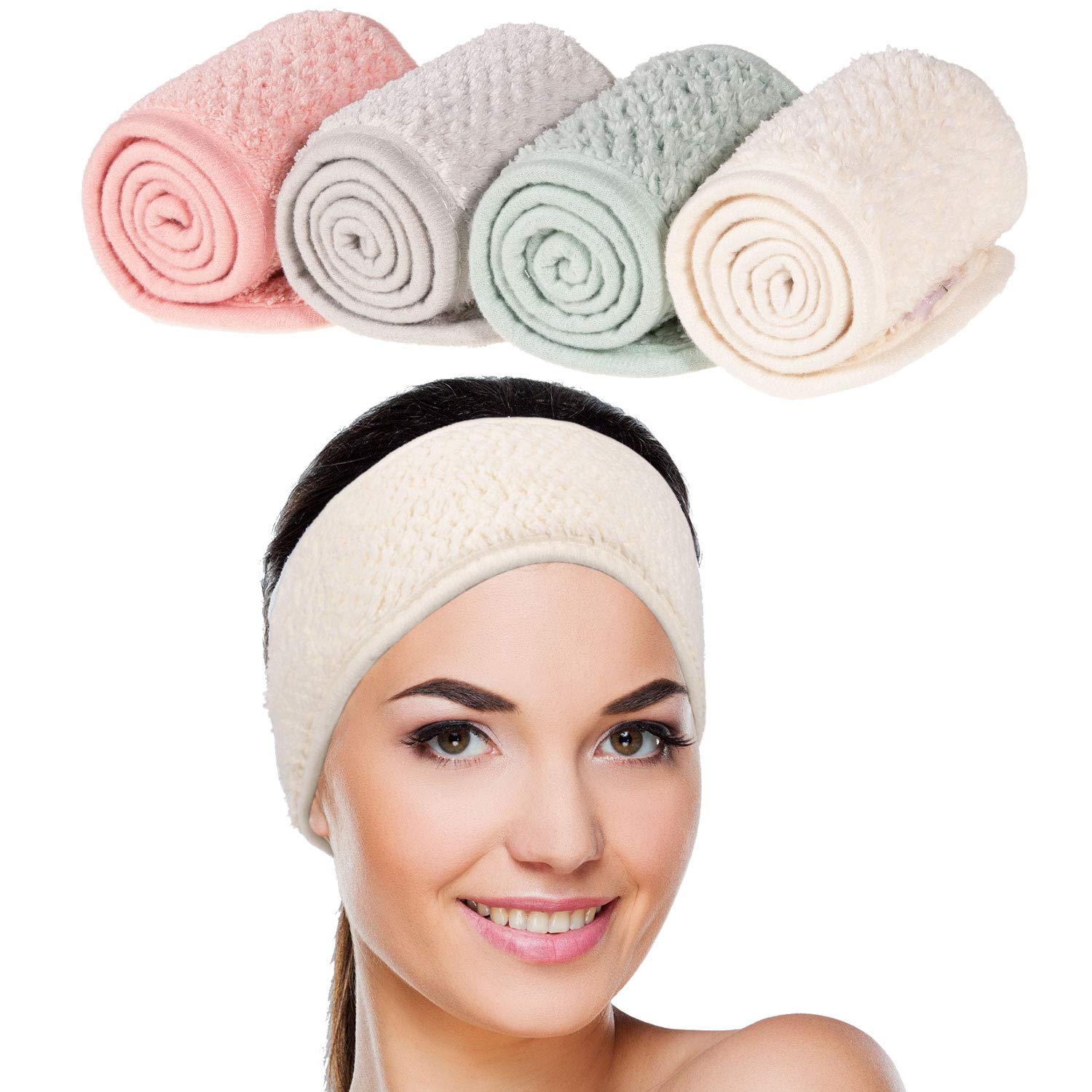 Four Whaline spa facial headbands in pea green, pink, beige and light gray displayed flat