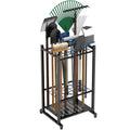 Heavy duty steel garage tool rack holding rakes, brooms, mops mounted on wall