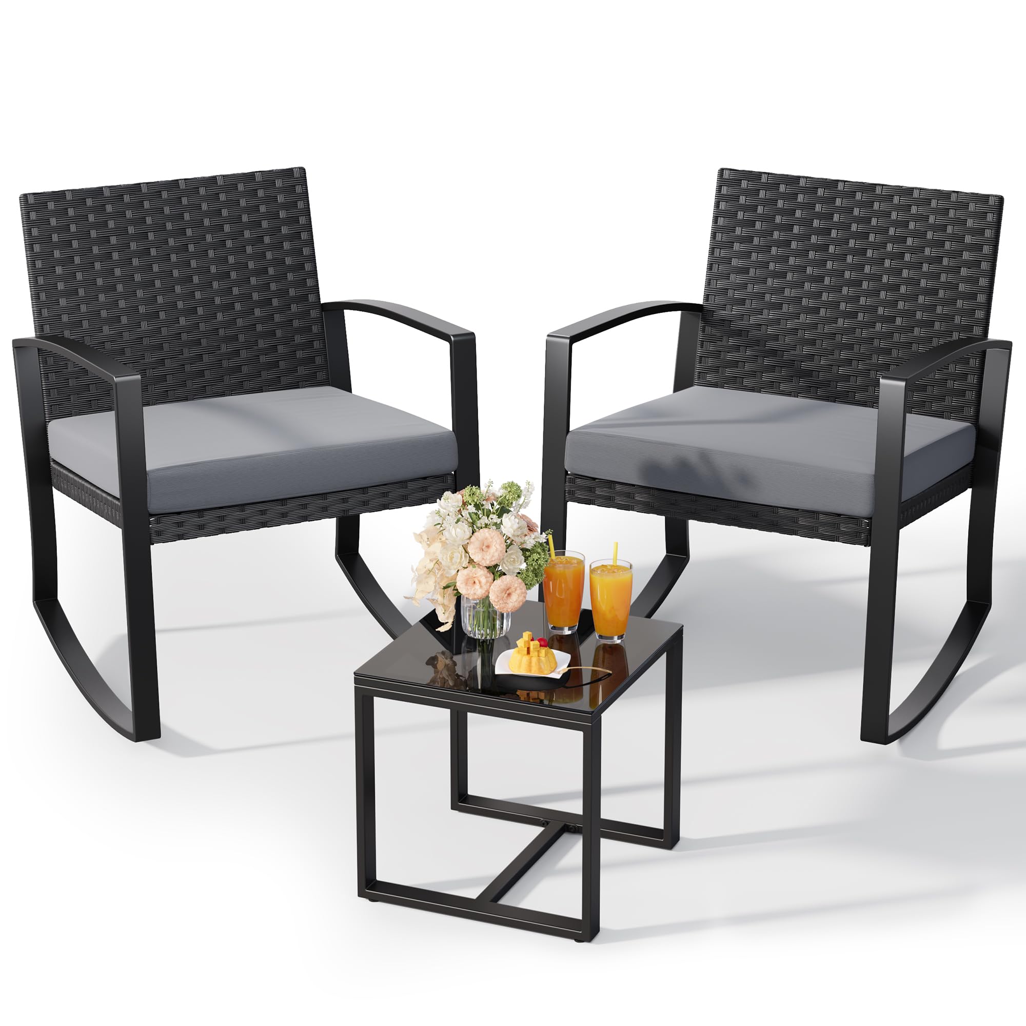 Grey cushioned Qsun rattan rocking bistro chairs and coffee table on patio