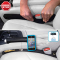 Two Drop Stop seat gap fillers installed between car seat and center console plus dash pad and small LED light