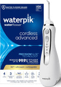 White Waterpik cordless rechargeable water flosser on a bathroom countertop