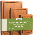 Three deep-carbonized bamboo cutting boards of different sizes showing wood grain