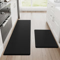 Black StepRite two-piece anti-fatigue kitchen mats on tile floor