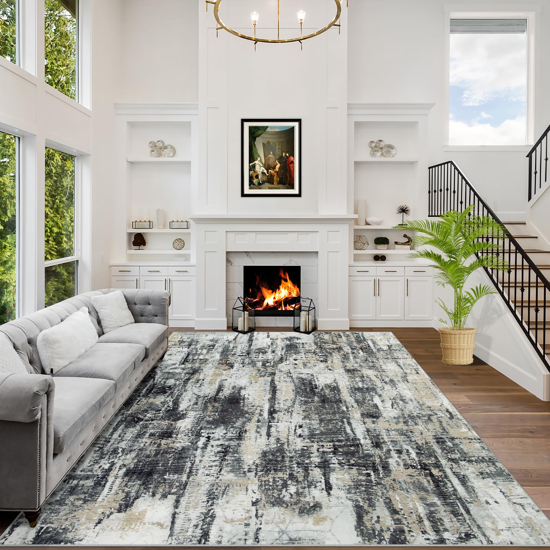 8x10 washable abstract rug in black, grey and gold on a living room floor