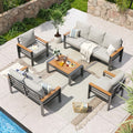 Aoxun 7-seat aluminum patio sectional with beige washable cushions and matching coffee table on a wooden deck