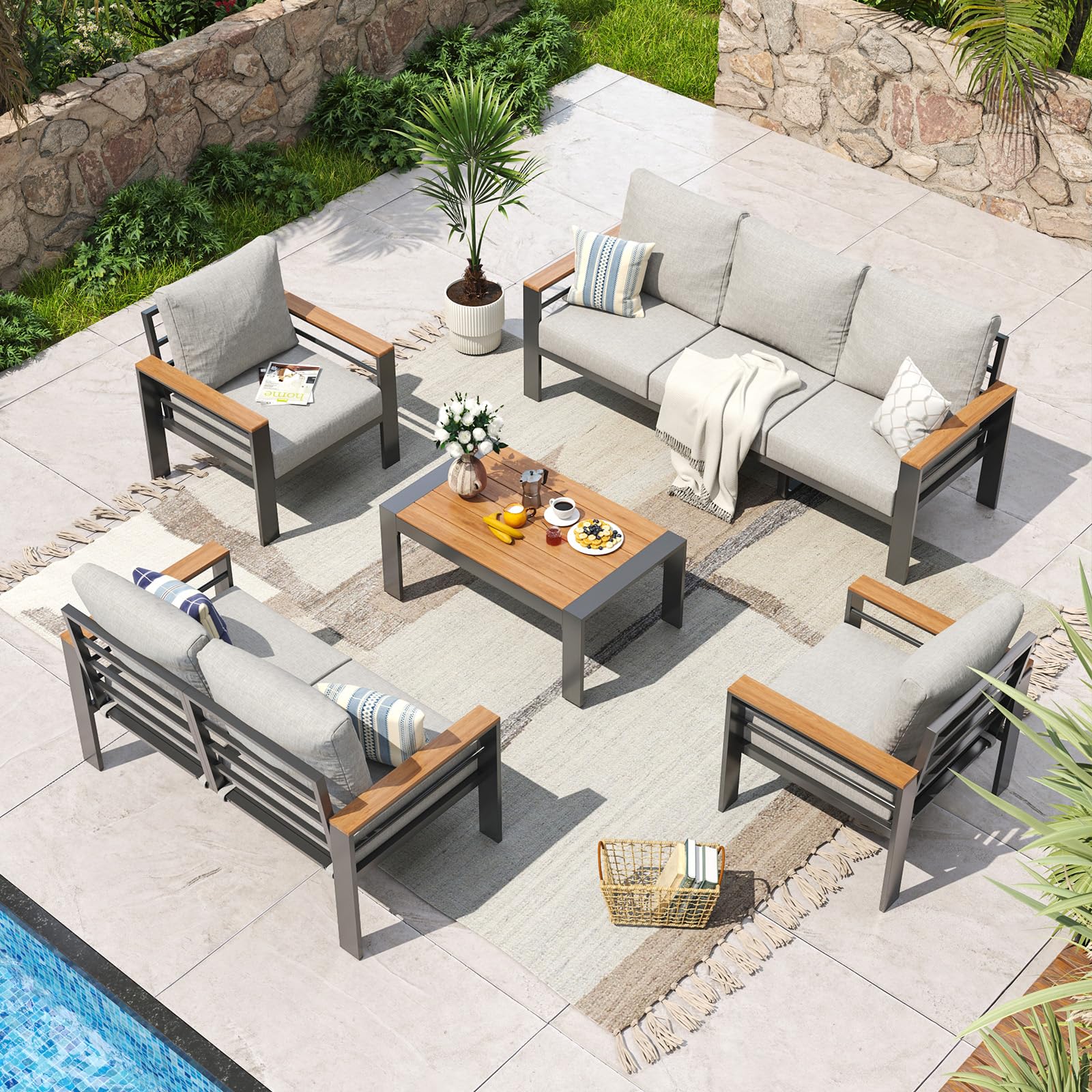 Aoxun 7-seat aluminum patio sectional with beige washable cushions and matching coffee table on a wooden deck