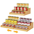 Three-tier expandable bamboo can rack holding canned goods on a countertop