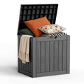 Black MAIUSCOLI 35 gallon lockable outdoor deck storage box on a patio