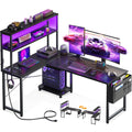 AODK L-shaped gaming desk in black with LED strip lighting and built-in power outlet