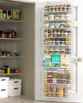 White metal 9-tier over-the-door pantry organizer hanging on a door with jars and cans